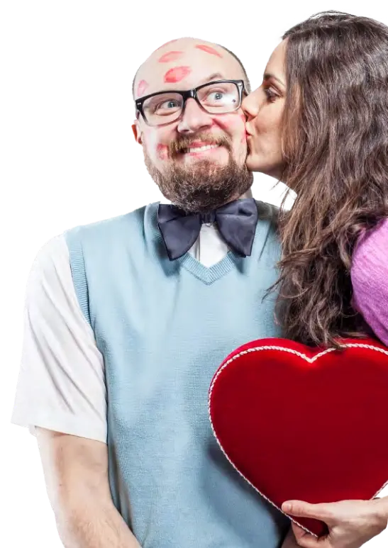 Photo of a woman kissing a man on his cheek